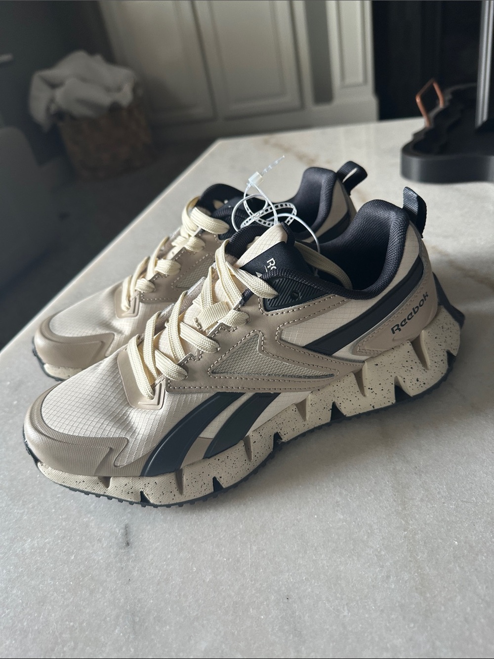 Reebok Cream and Black Zig-Pattern Athletic Sneakers